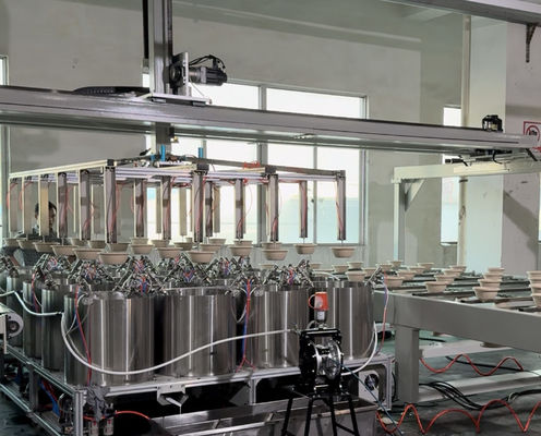 สายการเคลือบแบบหมุนอัตโนมัติความแม่นยำสูงสำหรับการเคลือบภายในผลิตภัณฑ์ขึ้นรูปเยื่อกระดาษที่สม่ำเสมอ